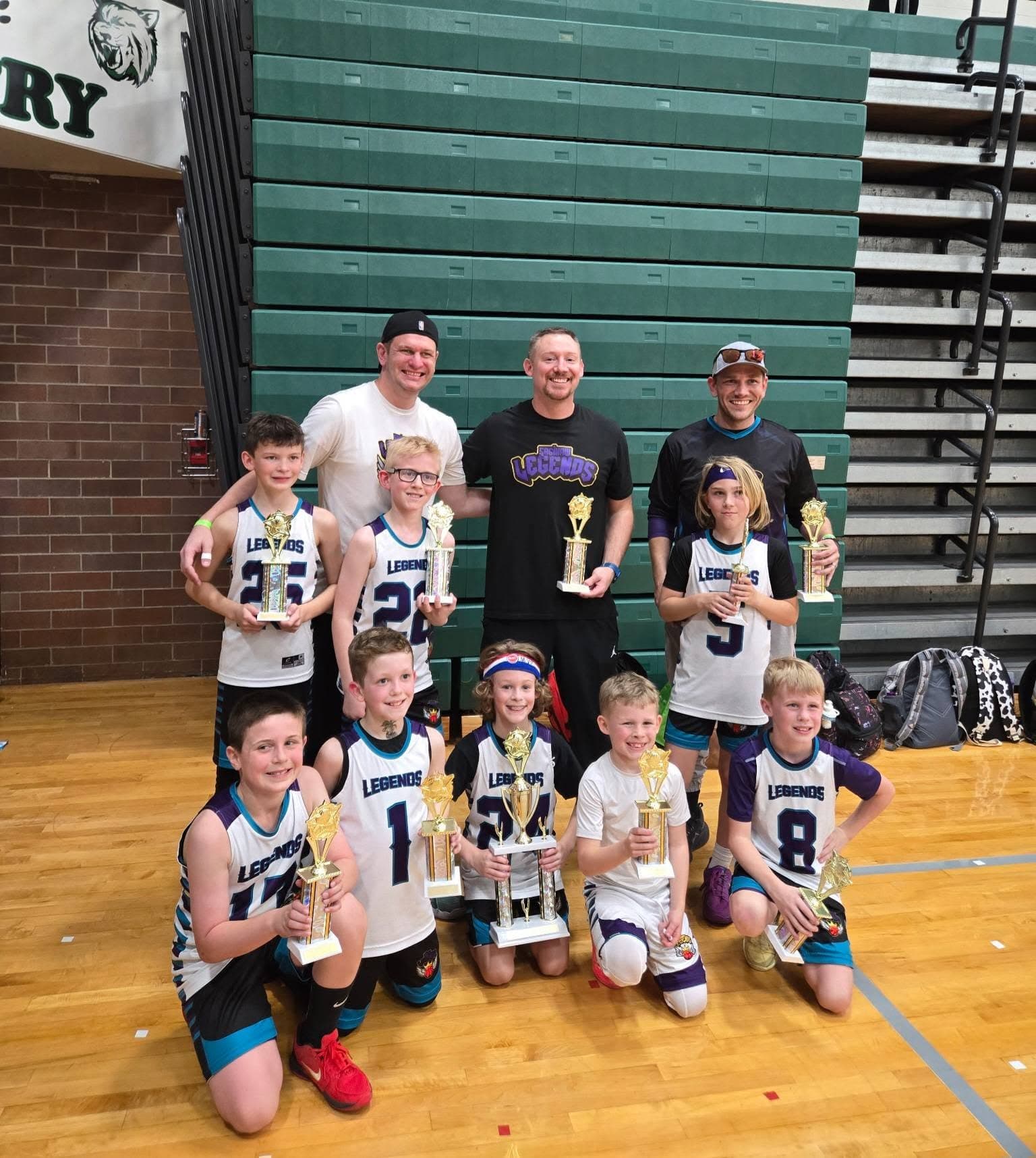 Legends team with first-place tournament trophies